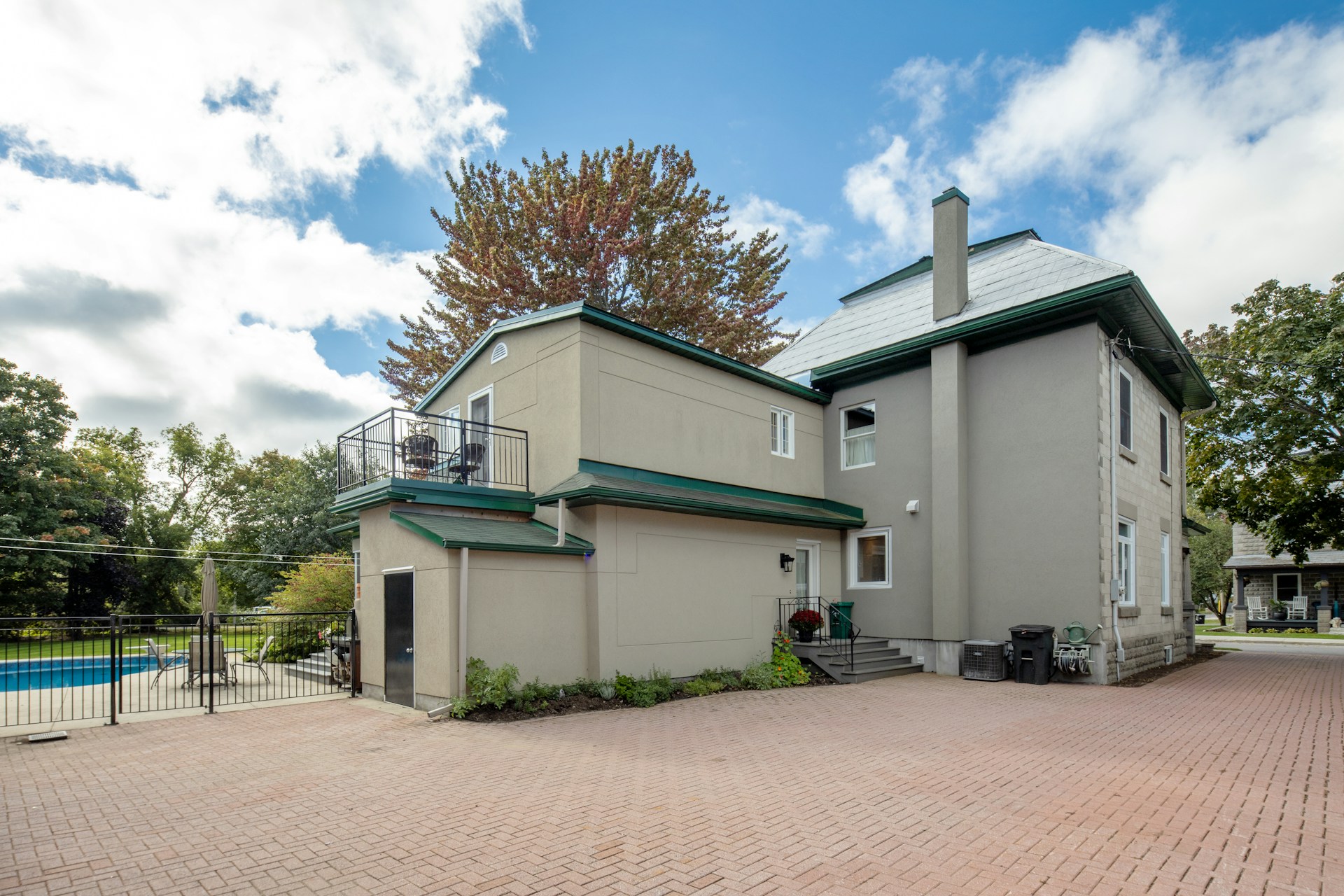 a house with a brick driveway hd estates